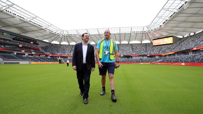 Sports Minister Stuart Ayres on the turf with curator Graham Loganon. Image: Sam Ruttyn