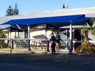 Police outside Wooli Bowling Club after reports a van smashed into the club and two other cars before speeding off. Picture: Nikki Voss