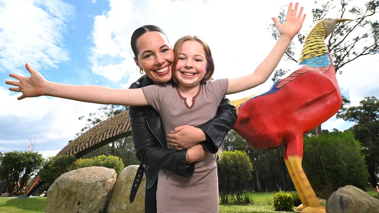 Belinda Deeney with her daughter, Indie, who was born under the enormous golden pheasant at Gumbuya World Theme Park. Picture: Josie Hayden.