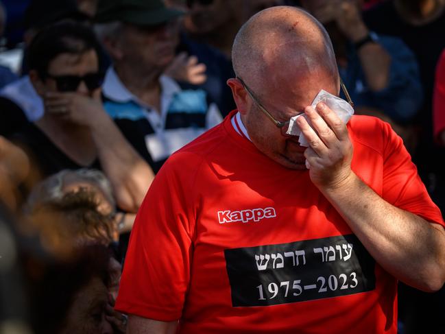 TEL AVIV, ISRAEL - OCTOBER 20: A man cries as friends and family attend the funeral of Omer Hermesh, who was killed by Hamas militants during the 7/10 invasion of Kibbutz Kfar Aza, at Shfayim cemetery on October 20, 2023 in Tel Aviv Israel. As Israel prepares to invade the Gaza Strip in its campaign to vanquish Hamas, the Palestinian militant group that launched a deadly attack in southern Israel on October 7th, worries are growing of a wider war with multiple fronts, including at the country's northern border with Lebanon. Countries have scrambled to evacuate their citizens from Israel, and Israel has begun relocating residents some communities on its northern border. Meanwhile, hundreds of thousands of residents of northern Gaza have fled to the southern part of the territory, following Israel's vow to launch a ground invasion. (Photo by Leon Neal/Getty Images)