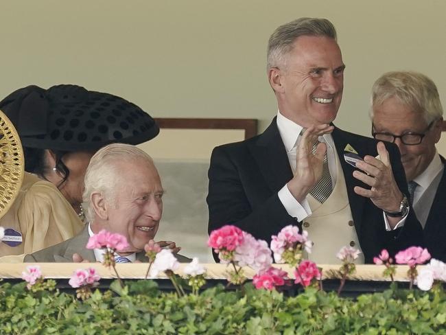 ASCOT, ENGLAND - JUNE 18: Neil Wilson, Chairman of VRC (2R) watching from the Royal Box with King Charles III delights at an Australian horse Asfoora winning The King Charles III Stakes during day one of Royal Ascot 2024 at Ascot Racecourse on June 18, 2024 in Ascot, England. (Photo by Alan Crowhurst/Getty Images for Ascot Racecourse)