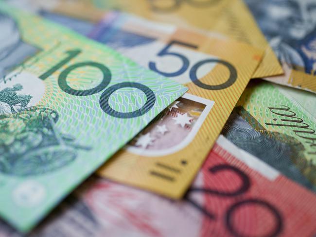 Australian money background showing $100, $50 and $20 notes with a shallow depth of field.