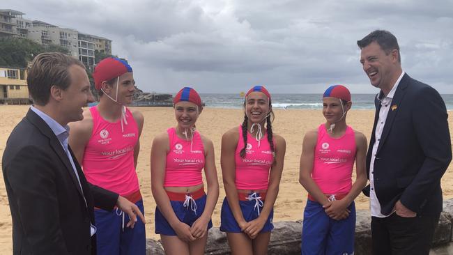 State Liberal MP for Manly, James Griffin (left) and Northern Beaches Mayor Michael Regan with junior lifesavers Guy Ormond, Aly Rounsley, Luana Da Rocha and Zac Gedz from the Queenscliff Surf Life Saving Club. Picture: Jim O'Rourke