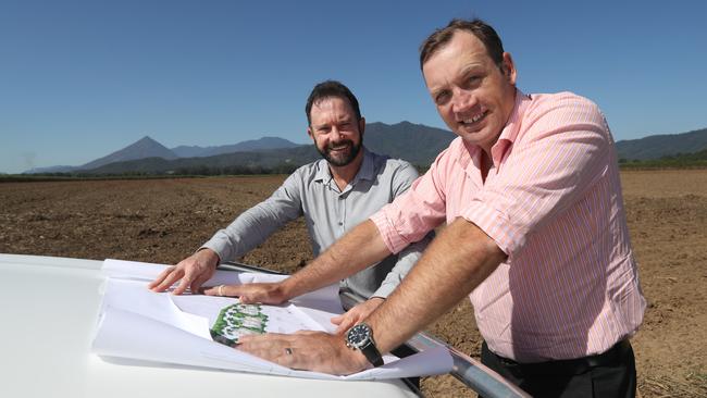 Robert Wheeler from Cardno and Ben Johnston from the Property Shop at Cooper Rd in Mount Peter where a potential 1500-lot residential estate has been flagged. PICTURE: STEWART McLEAN