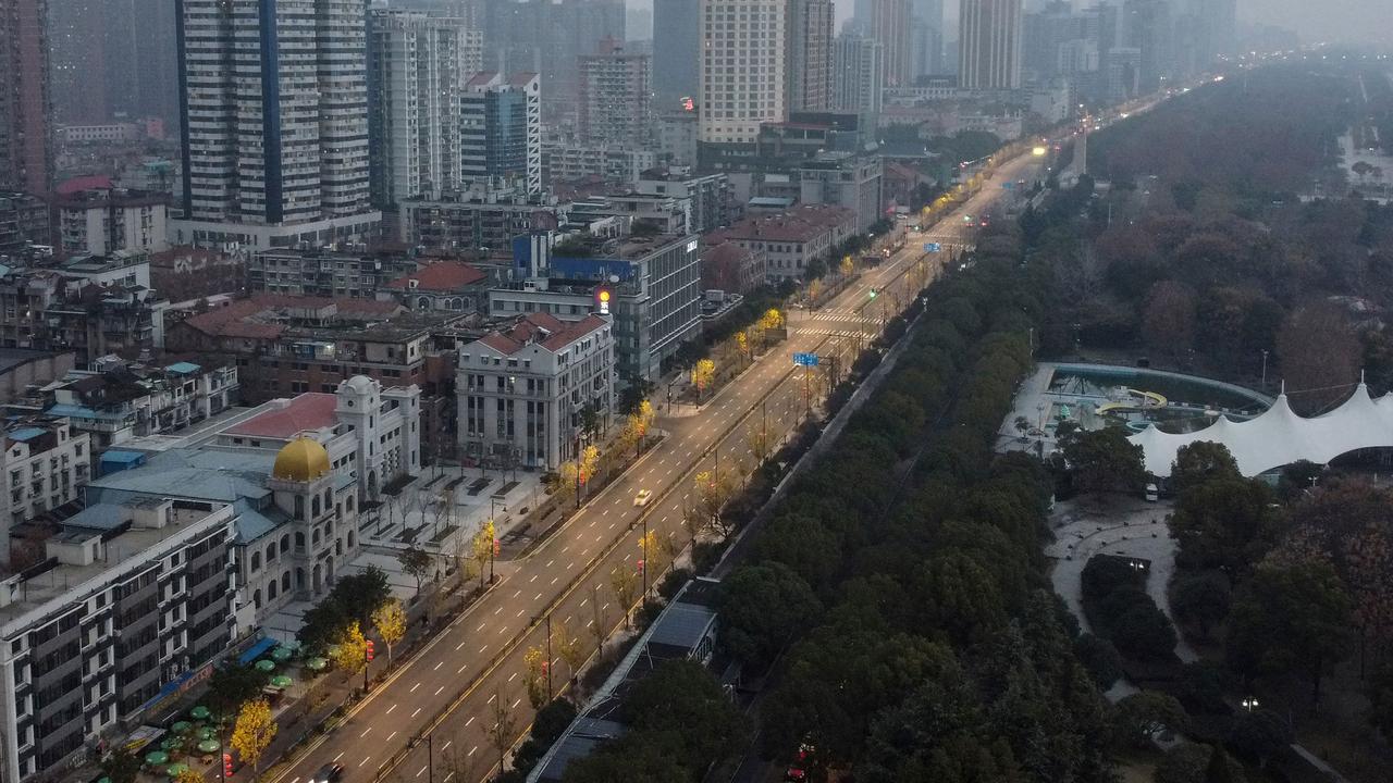 An aerial view of residential and commercial buildings in Wuhan and a deserted road. Picture: Hector Retamal/AFP
