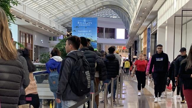 Queues of customers wait to get into Apple at Chadstone. Picture: Supplied