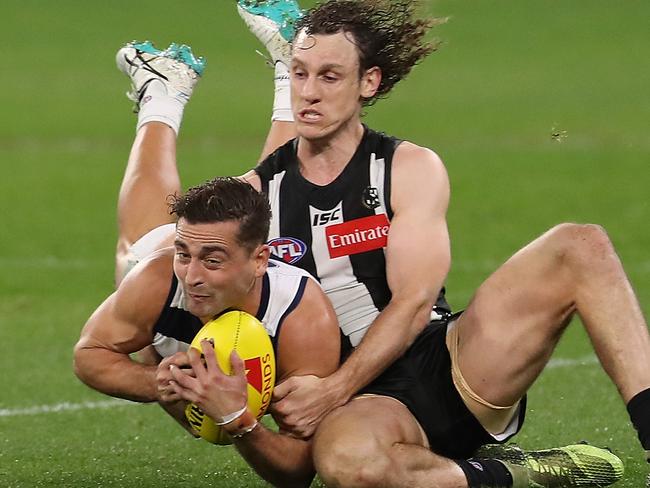 PERTH, AUSTRALIA - JULY 16: Chris Mayne of the Magpies tackles Luke Dahlhaus of the Cats during the round 7 AFL match between the Geelong Cats and the Collingwood Magpies at Optus Stadium on July 16, 2020 in Perth, Australia. (Photo by Paul Kane/Getty Images)