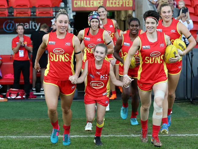 The Suns team runs out during the AFL QW Winter Series match between the Gold Coast Suns and the Brisbane Lions at Metricon Stadium on May 25, 2019 in Gold Coast, Australia. (Photo by Jono Searle/AFL Photos/Getty Images)