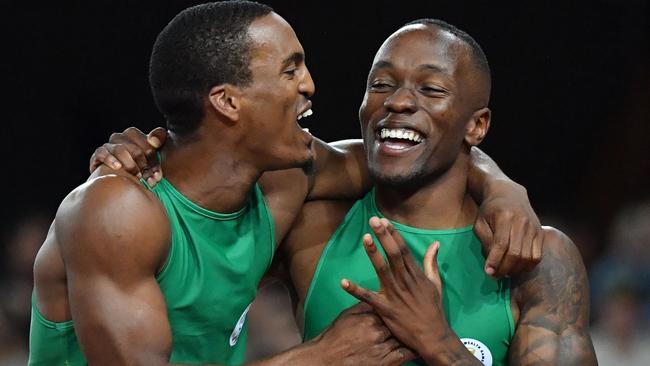 South Africa’s Henricho Bruintjies (left, silvermedal ) and Akani Simbine (gold) celebrate after the men's 100m final at the Commonwealth Games.