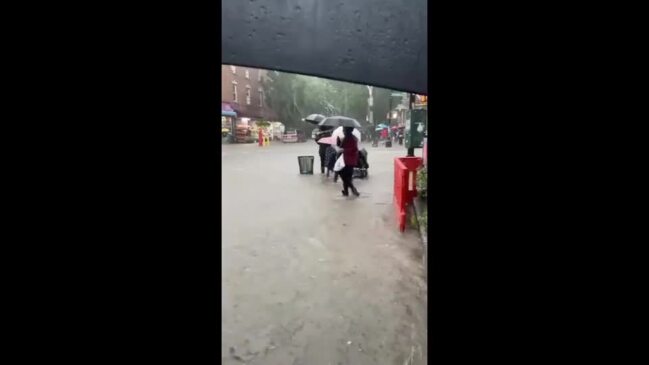 New Yorkers Trudge Through Ankle-Deep Water as Flash Flooding Soaks ...