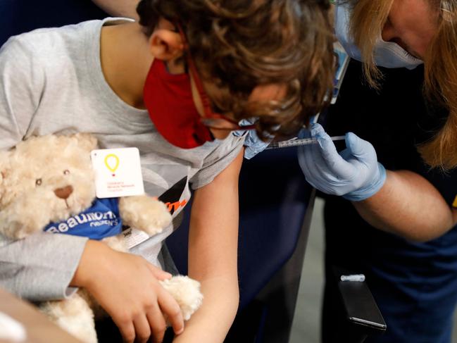 A seven-year-old receives their first dose of the Pfizer vaccine in Michigan. Picture: Jeff Kowalsky/AFP