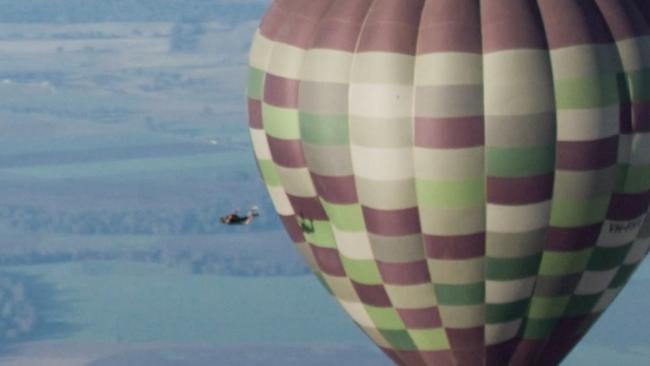 Rider, spotted left, parachuting off the edge. Picture: Supplied.