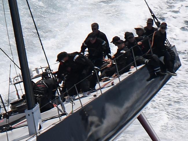 Comanche takes the lead over Info Track as the field makes its way down the coast following the start of the Sydney to Hobart Yacht race in Sydney, Thursday, December 26, 2019. (AAP Image/Dean Lewins) NO ARCHIVING, EDITORIAL USE ONLY