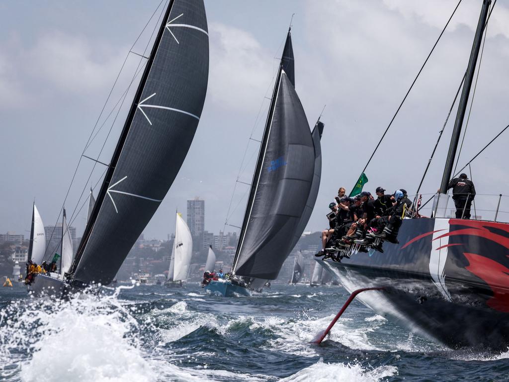 Yacht Andoo Comanche (R) jostles for position at the start of the 2023 Sydney to Hobart. Picture: AFP