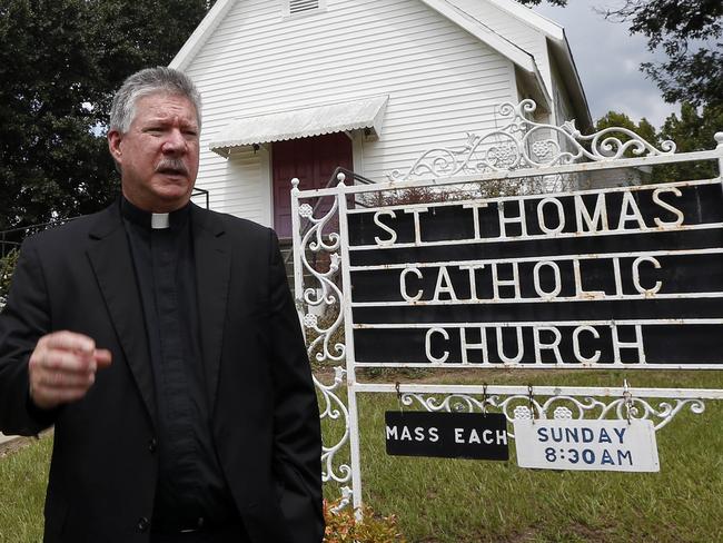 Rev. Greg Plata, speaks outside the St. Thomas Catholic Church in Lexington, Miss., about the community loss with the murders of Sister Margaret Held and Sister Paula Merrill. Picture: AP.