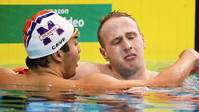 Daniel Cave comforts a distraught Matthew Wilson who just missed out on qualifying in the Men’s 200m breaststroke final. Picture: Getty Images