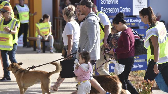 Evacuees arrive at the Somerville relief centre on Saturday after being evacuated aboard HMAS Choules. Picture: Getty Images