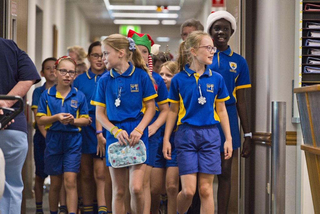 Leading the group are Chloe Wright (left) and Sophie Wood as Mater Dei Primary School Yr 4 students sing Christmas carols in the wards of St Vincent's Private Hospital, Friday, November 29, 2019. Picture: Kevin Farmer