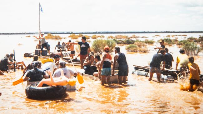 Mintabie locals in the seasonal lake after heavy rains during the town’s glory years. Picture: Supplied
