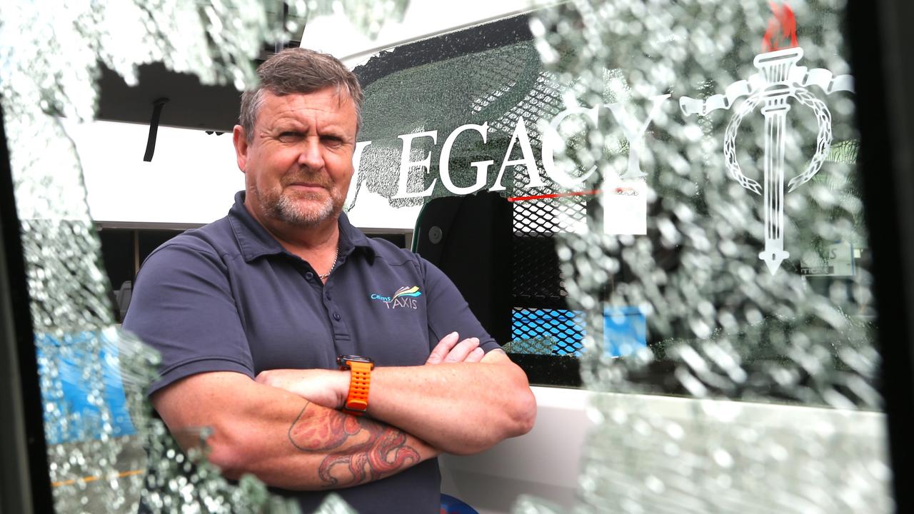 Cairns Taxis chief executive Bob Epps stands in front of a vehicle that was the target of a suspected shooting incident on Sheridan St in an escalation of usual rock throwing attacks on cabs. Picture: Peter Carruthers