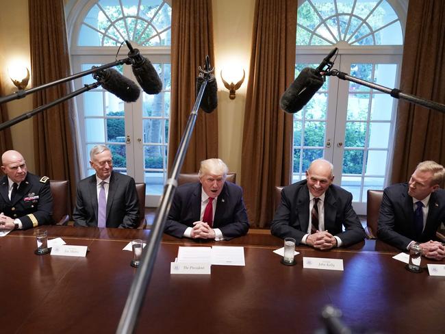 Donald Trump, flanked by Defense Secretary James Mattis (left), and Chief of Staff John Kelly (right), meets with senior military leaders in the Cabinet Room of the White House. Picture: Mandel Ngan/AFP