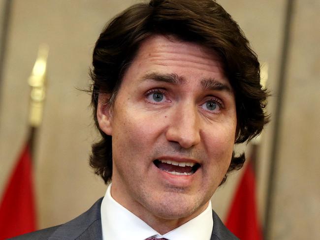 Canada's Prime Minister Justin Trudeau comments on the on going truckers mandate protest during a news conference on Parliament Hill in Ottawa, Canada on February 14, 2022. - Canadian Prime Minister Justin Trudeau on February 14, 2022 invoked rarely-used emergency powers to bring an end to trucker-led protests against Covid health rules, after police arrested 11 people with a "cache of firearms" blocking a border crossing with the United States. (Photo by Dave Chan / AFP)