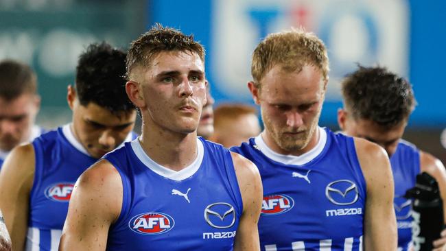 DARWIN, AUSTRALIA - MAY 11: The Kangaroos look dejected as they leave the field after the 2024 AFL Round 09 match between the Gold Coast SUNS and North Melbourne Kangaroos at TIO Stadium on May 11, 2024 in Darwin, Australia. (Photo by Dylan Burns/AFL Photos via Getty Images)