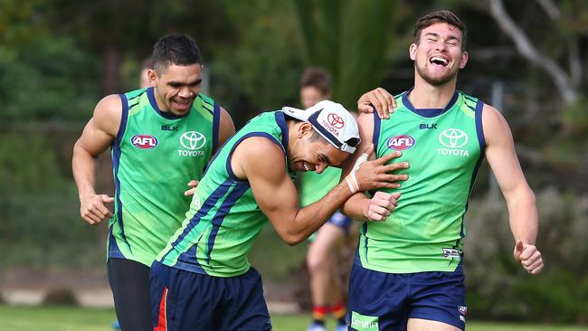 Eddie Betts, Mitch Grigg and Charlie Cameron joke around at Crows training. Picture: Sarah Reed