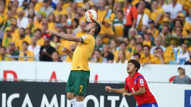 Ivan Franjic of Australia heads the ball during the 2015 Asian Cup final.