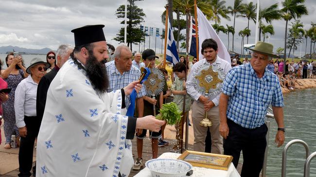 The celebration of the Epiphany is one of the most sacred in the calendar of the Greek Orthodox faith. It is the throwing of the Cross Ã&#144; and blessing of the waters. Held in Townsville at the rock pool. Father Sotirios Papafilopoulos. Picture: Evan Morgan