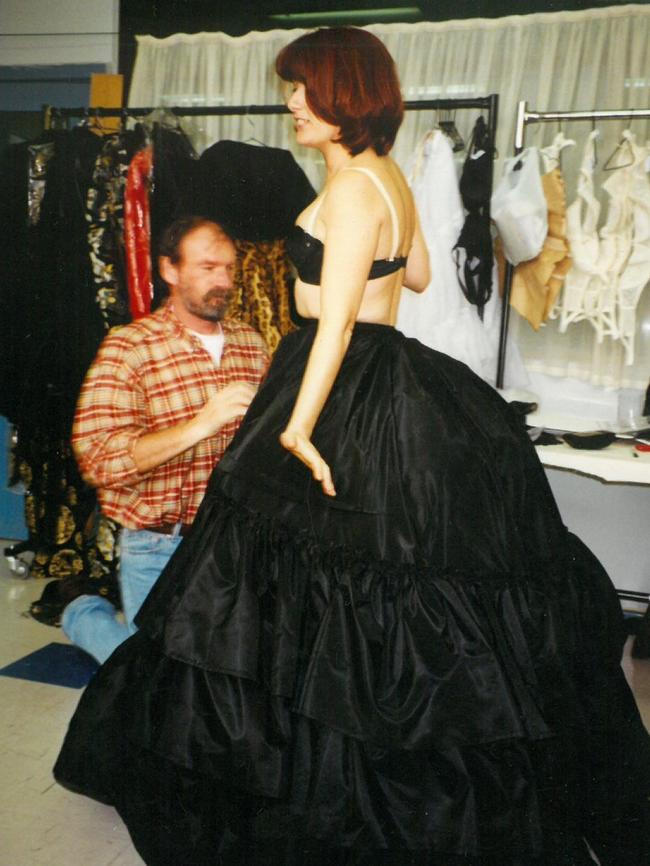 Launceston corset maker Anthony Phillips fits Debra Byrne into a costume for Sunset Boulevard, 1996. Picture: Supplied.