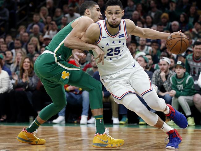 Ben Simmons (right) drives past Boston Celtics' Jayson Tatum during the second half of an NBA basketball game in Boston. Picture: AP