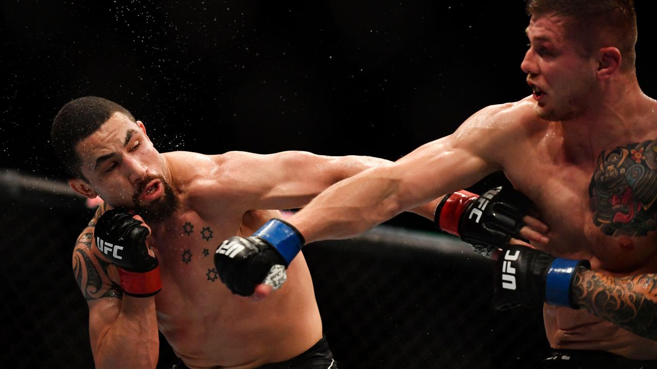 New Zeland's Robert Whittaker (L) competes against Italy's Marvin Vettori in their men's heavyweight fight during the Ultimate Fighting Championship (UFC) Fight Night 209 event at the Paris-Bercy arena in Paris on September 3, 2022. (Photo by JULIEN DE ROSA / AFP)