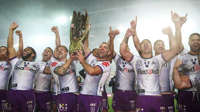 Cameron Munster and Cameron Smith celebrate after winning the 2020 NRL grand final. The Storm have had an astonishing 122 weeks in top spot (Photo by Cameron Spencer/Getty Images)