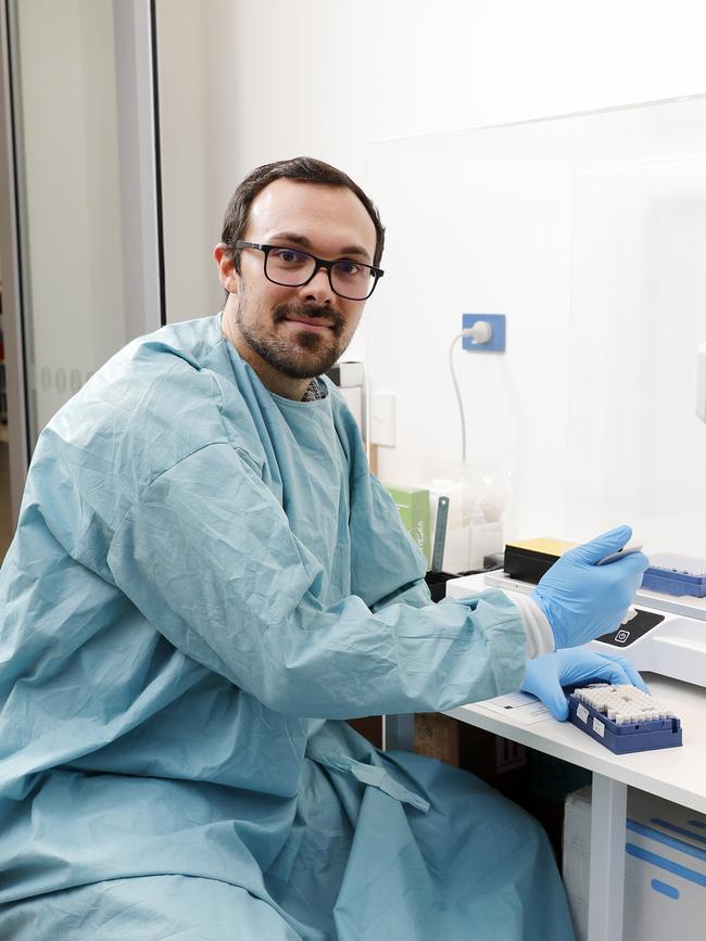 Lab scientist Matt Hadaway monitoring the set up of the Covid-19 testing plate. Picture: AAP