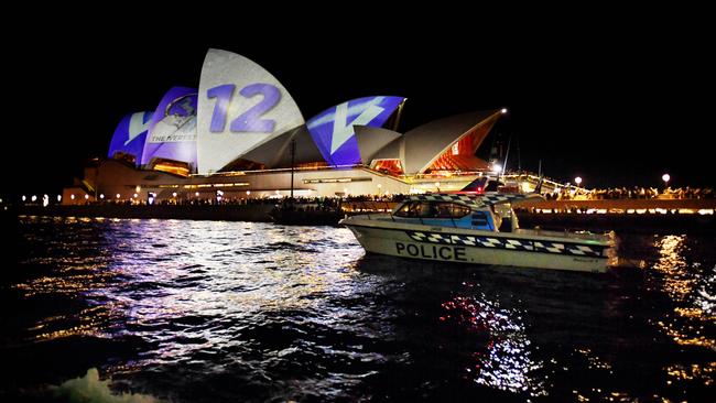 The Sydney Opera House is lit up with The Everest barrier draw numbers and corresponding jockey colours. Picture: Tracey Nearmy