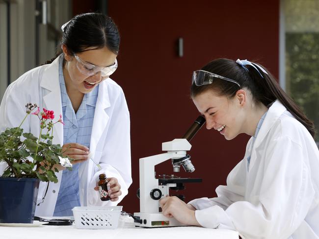 DAILY TELEGRAPH JANUARY 17, 2022. Roseville College year 11 and 12 students Sarah Cornwell, 16, (left) and Kiana Appleyard, 17, doing some science experiments together outside the schools new science labs. Picture: Jonathan Ng