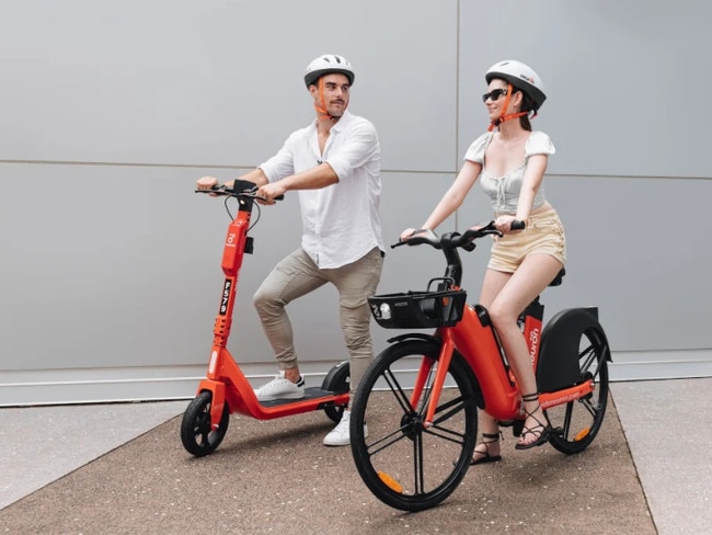 Robbie Turnbull and Veruschka Warde enjoy the Neuron eScooter and eBike, with 150 of each to be added to the existing fleet of eScooters across Darwin early next month. Picture: Supplied