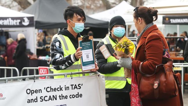 Tasmania's Own Market/Salamanca Market with some people wearing masks and people using the check in Tas app to register attendance. Picture: Nikki Davis-Jones