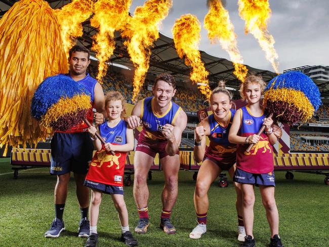 Lions players Lachie Neale and Emily Bates with fans Ismail Mohammed, Frankie Drake and Indie Mutimer celebrate the Lions breaking their membership record for 2022. Picture: Lachie Millard