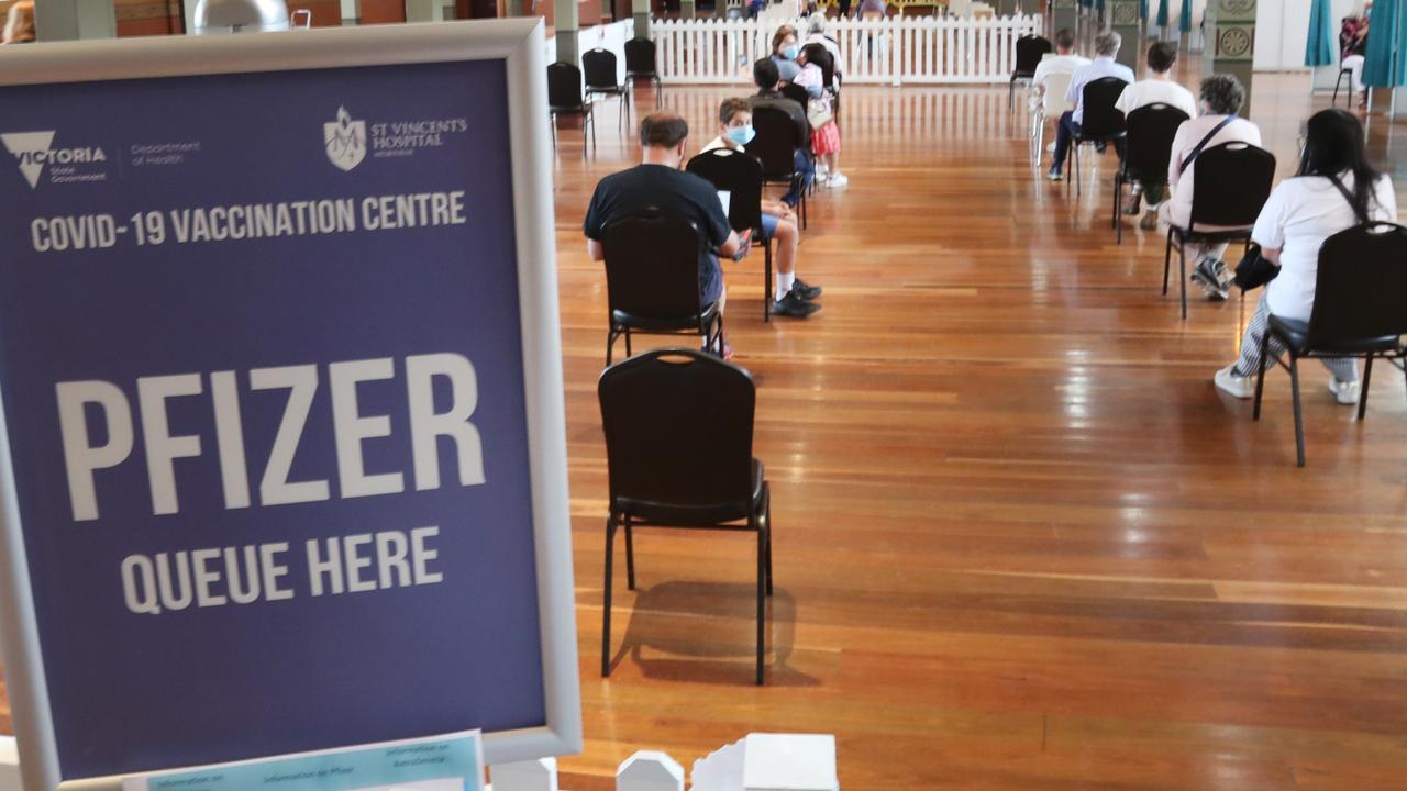 A large line of people inside the Melbourne Royal Exhibition waiting for Covid vaccinations including the third booster shot. Picture: NCA NewsWire / David Crosling