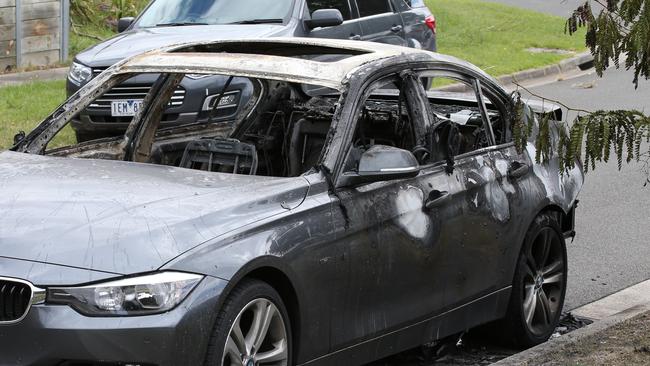 The remains of the burnt-out car being investigated over a link to the Kittens fire bomb attack. Picture: David Crosling