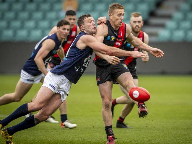 Jobi Harper lays a diving tackle on Brad Cox-Goodyer. Picture: LUKE BOWDEN