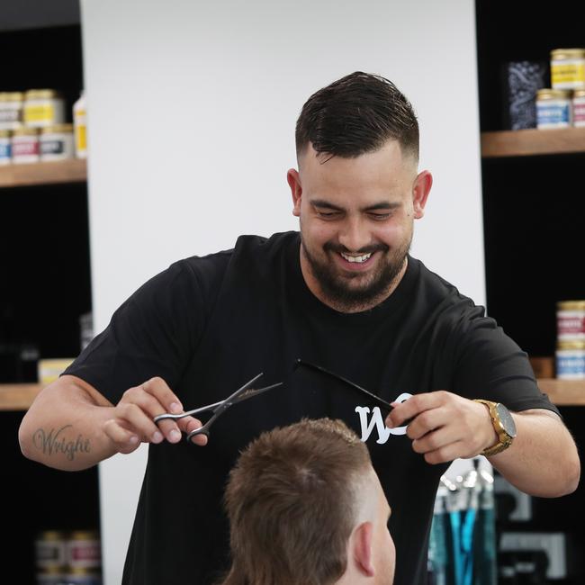 Barber Nathan Piras at Walkabout Barbers. Picture: Sue Graham