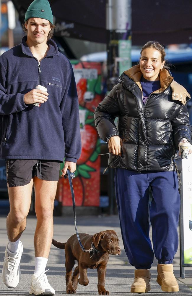 The pair walks Silvagni’s puppy, Lenny, in Elsternwick. Picture: Media Mode