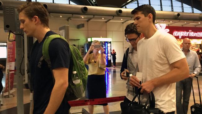 Three of the nine Australian men arrested over indecent exposure arrive at Kuala Lumpur International Airport in Malaysia on Thursday. Picture: AAP/Lauren Farrow.