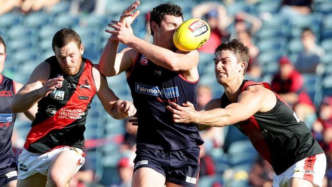 Alexis Georgiou misses the ball under pressure from West players. Picture: Sarah Reed