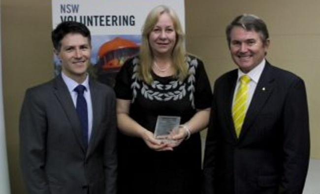 VOLLIE OF THE YEAR: Susan Biggar with NSW Minister for Citizenship and Communities Victor Dominello (left) and Ballina MP Don Page. . Picture: Contributed