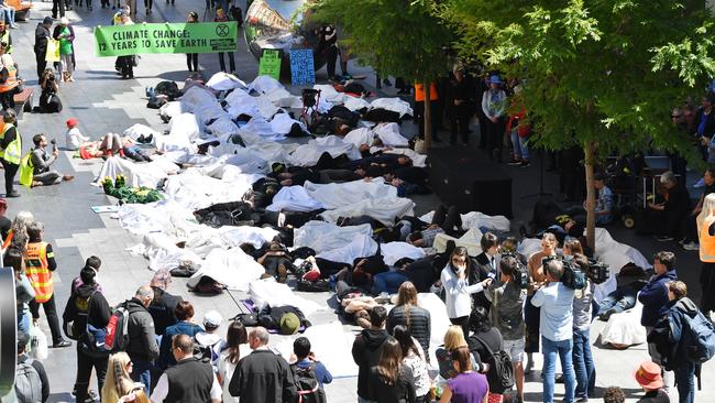 About 80 “died” while a crowd of others looked on. Picture: AAP Image/David Mariuz