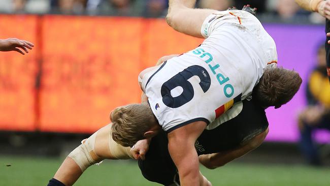 Carlton’s Patrick Cripps is taken high by Adelaide’s Rory Sloane. Picture: Michael Klein